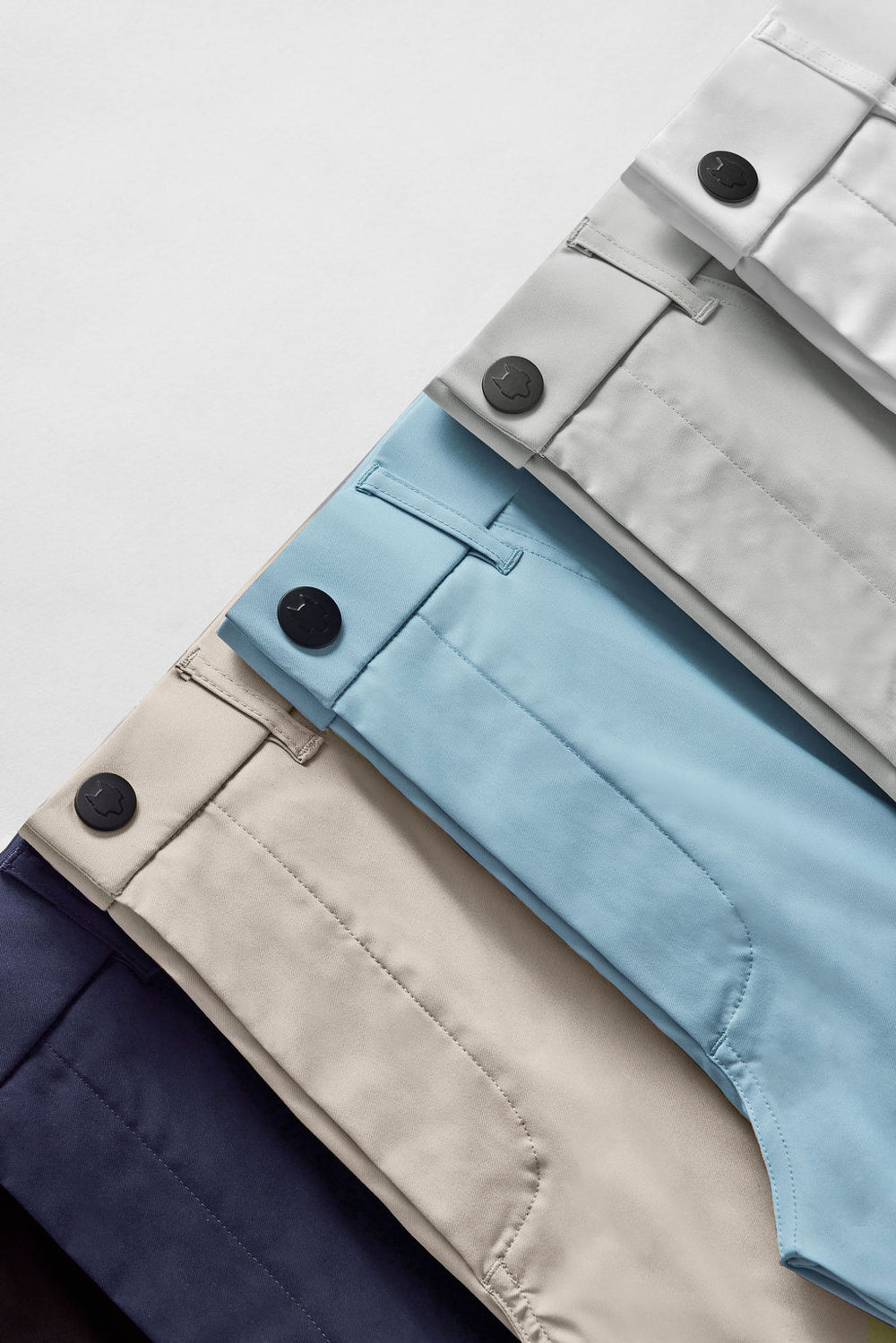 a collection of light colored pants